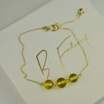 Delikatna złota bransoletka ze słonecznym bursztynem pr. 585