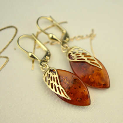Złote wiszące kolczyki z koniakowym bursztynem pr. 585